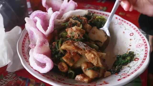 Enjoying traditional Indonesian pecel.