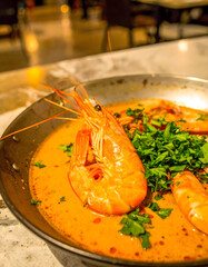 Spicy Prawn Soup in Metal Bowl Restaurant Setting
