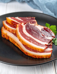 Fresh Raw Bacon Rashers with Herb Garnish

