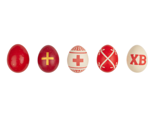 A row of five decorated Easter eggs on a black background