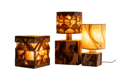 Three wooden lamps, showcasing geometric and natural patterns, glowing against black