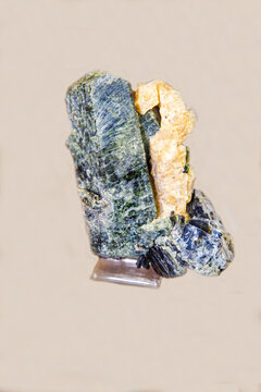 Phlogopite is gray in color on a light background. Gems, mineralogy, jewelry.