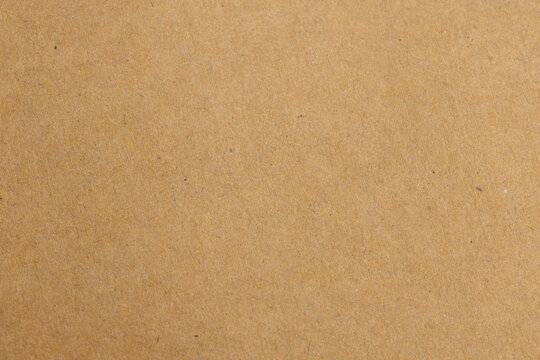 Brown Kraft Paper Texture Background with Natural Fiber Details,Macro shot of recycled brown kraft paper texture background. High-quality organic paper surface with visible natural fibers, perfect,