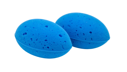 Two blue egg-shaped bath sponges with porous texture and dark background