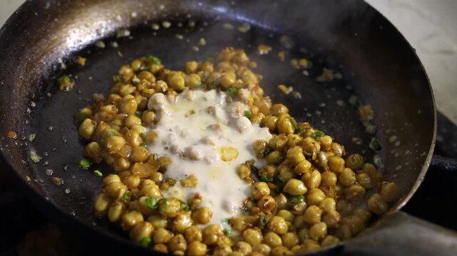 Chole masala or chana spicy curry eaten with bhature or kulcha