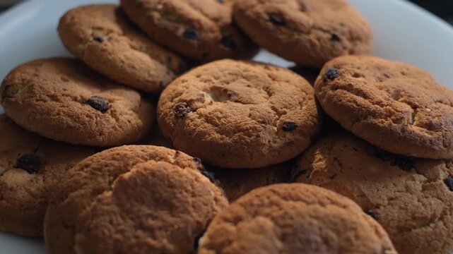 Appetizing fresh oatmeal cookies on a plate, close-up