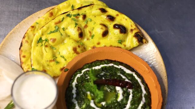 Makke ki roti sarso ka saag with buttermilk garnished with cream and butter
