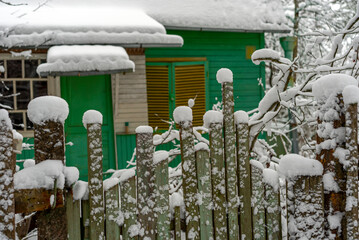 countryside house and fence in winter