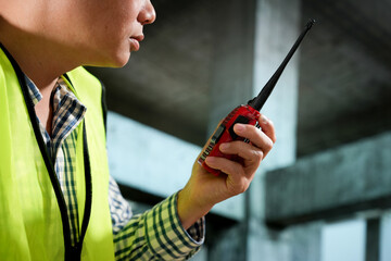 Civil engineers inspect building construction projects, checking the structural integrity and safety measures.