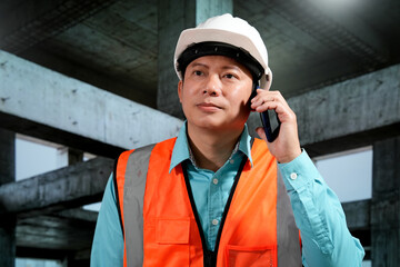 Civil engineers inspect building construction projects, checking the structural integrity and safety measures.