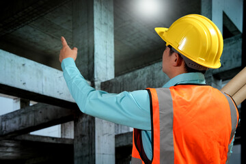Civil engineers inspect building construction projects, checking the structural integrity and safety measures.
