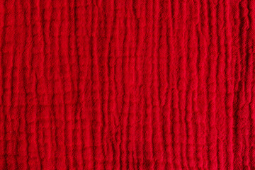 Fototapeta premium Lightweight red muslin cloth with wrinkled texture, fabric surface