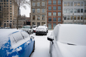 Cars parked in a Montreal parking lot after heavy winter snowfall