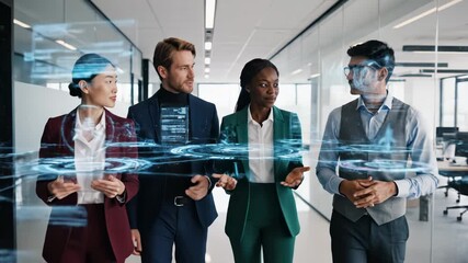 Four business people in office looking at tablets with futuristic graphics overlay - Powered by Adobe