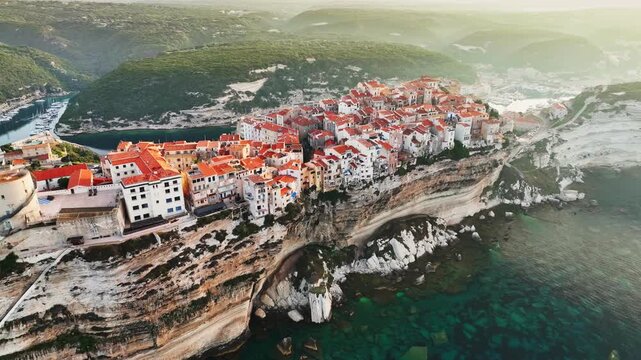 Aerial View of Bonifacio Cliffs and Old Town, Dramatic Limestone Coastline, Corsica Island, Mediterranean Sea, Cinematic Drone Footage, 4K