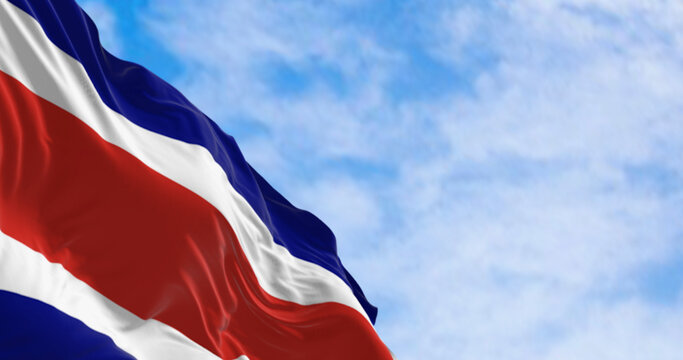 Costa Rica national civil flag waving in the wind on a clear day