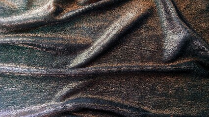 Metallic knit fabric, also known as Lurex fabric. The shiny appearance of the fabric is woven with...