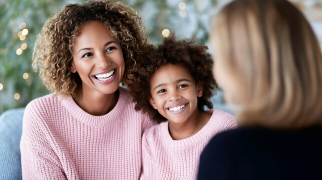 Mother and child smiling, embracing a positive outcome during a supportive consultation with a professional counselor - Powered by Adobe