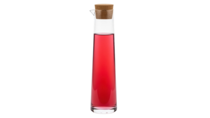 Elegant glass carafe with cork stopper and red liquid isolated PNG, stylish drinkware for serving water or juice on transparent background