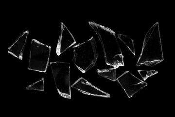 broken glass. several pieces of broken glass isolated on a black background