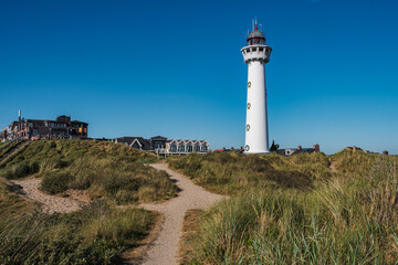 The Egmond aan Zee Lighthouse under a blue sky