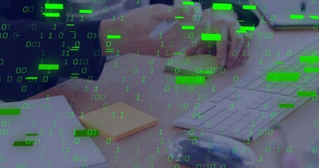 Clicking woman's hands in dark sleeve using keyboard and mouse at desk, with green binary overlay