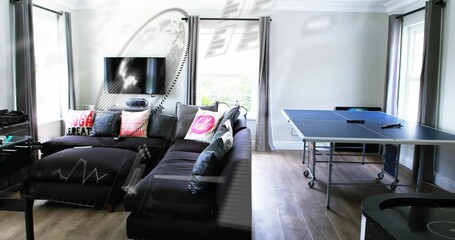Fototapeta premium Showing dark gray L-shaped sectional chaise left in living room, featuring blue ping pong table