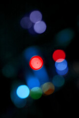 Vibrant colorful bokeh lights in dark background