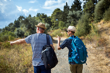 Summer hiking trip with father and teenage son. Active family time, trust, and connection while exploring nature, suitable for commercial and lifestyle use.