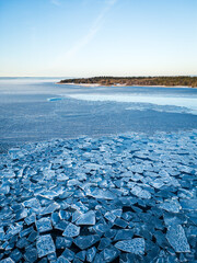 Low Aerial View of Prominent Ice Floes with Land near Lanken