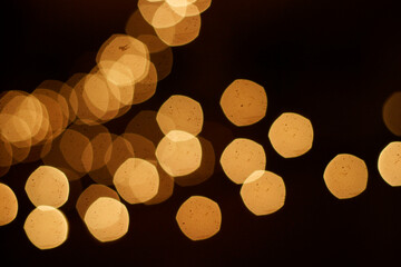 Warm golden bokeh lights on dark background