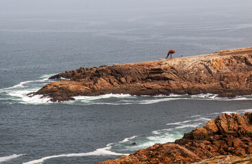 Horn sculpture on the rocks by the Hercules Tower in La Coruna, Spain