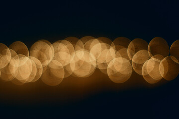 Warm golden bokeh lights on dark background