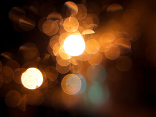 Warm bokeh lights in dark background