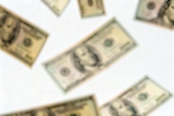 Dollar money floating Isolated on a White Background. Blurry image