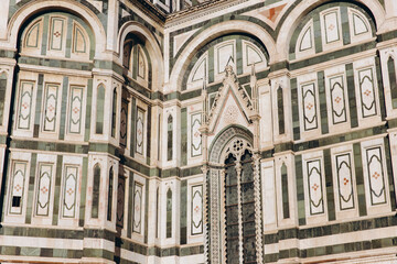 Naklejka premium Detail of Florence Duomo facade with marble patterns