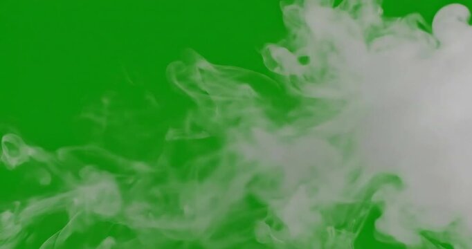 A calm atmospheric smoke effect on green screen background for video production motion graphics and visual effects white smoke slowly moving across the frame with serene