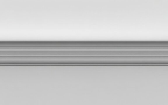 A close-up view of a classic white decorative wall molding or chair rail against a plain background