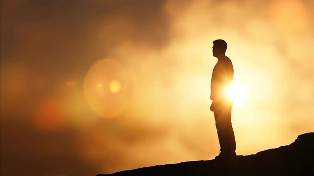 Man silhouettes changing pose on a hill against a vibrant sunset sky, depicting hope and spiritual journey footage