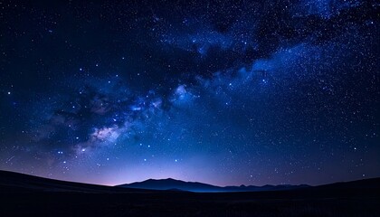 Obraz premium Dramatic Milky Way Night Sky with Starry Night over Dark Mountain