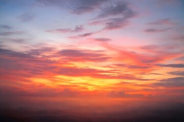 Fototapeta premium Colorful Dramatic Sunset Sky with Soft Clouds