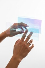 Hands interact with digital screens in a modern setting
