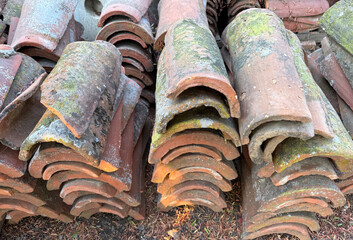 Stack of old used Mexican clay roof tiles