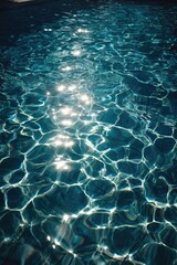 Fototapeta premium Sunlight glittering on the rippling blue pool water Concept Sunlit pool reflections, rippling blue water, glittering water surface, poolside sparkle, summer vibes