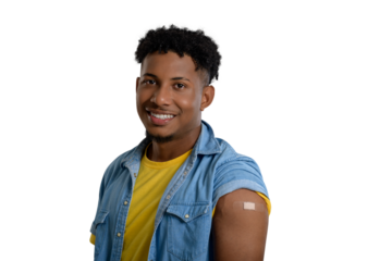 Smiling young man shows his arm after receiving a vaccine.