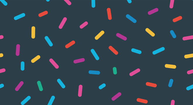 Fun seamless pattern of multicolored candy sprinkles scattered on a dark navy blue background for celebrations.