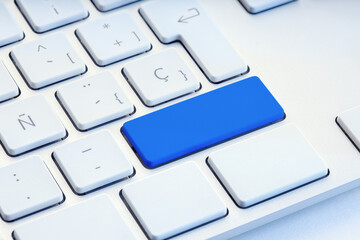 Blue blank key on white computer keyboard mockup