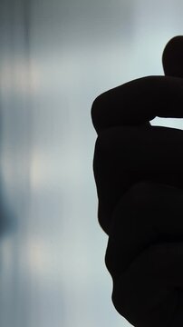 Man hand knocking on the door in a dark place. Home security and protection concept.	