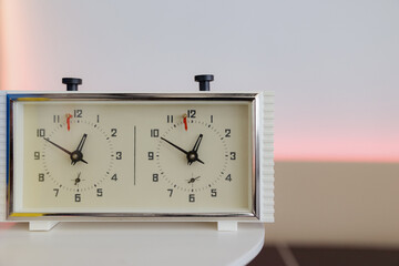 Chess clock ticks steadily as players engage in strategic masterpiece