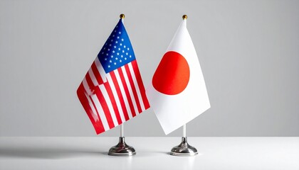 United States and Japan National Flags on Desk Stands with Sunset Sky Background